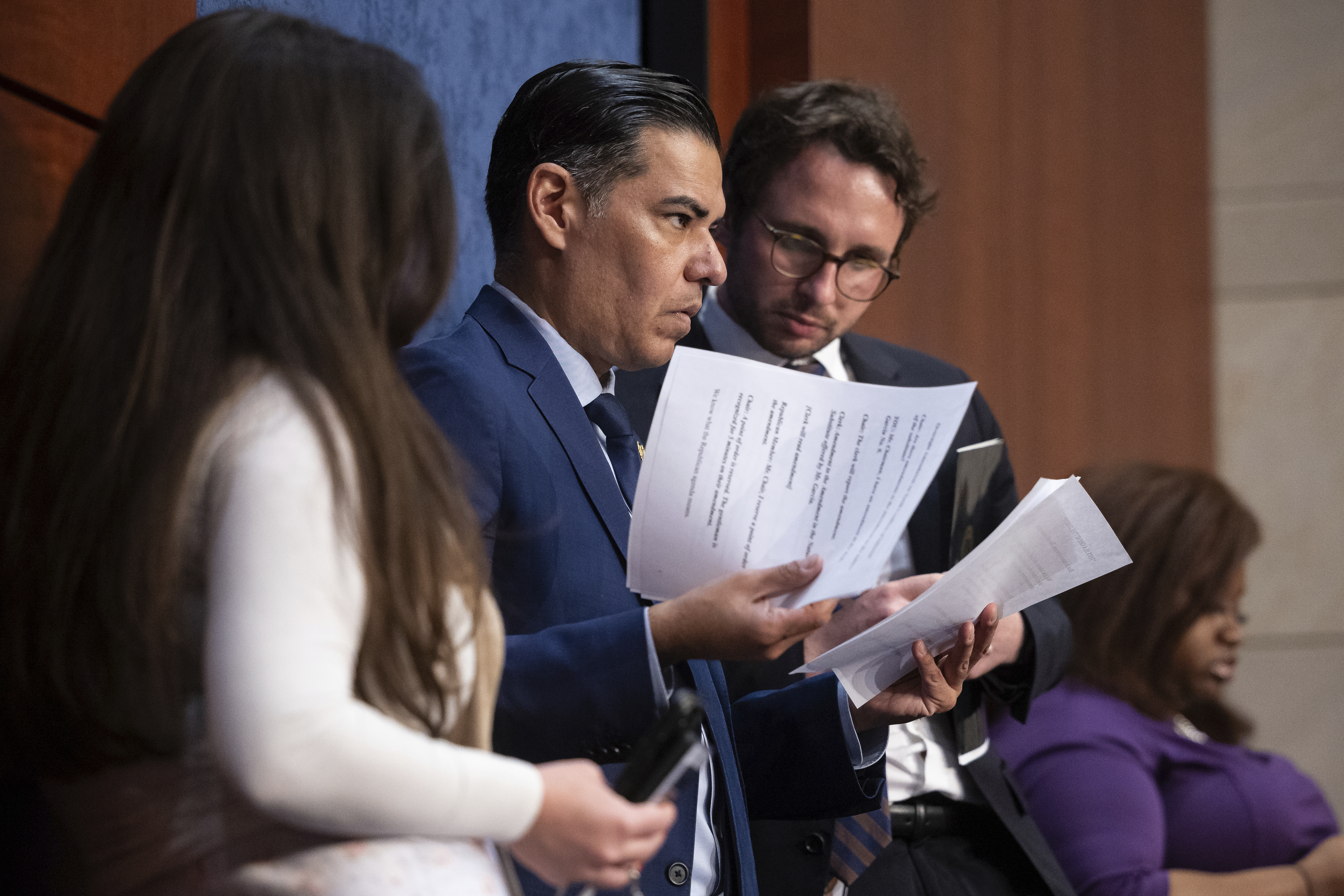 Rep. Robert Garcia (D-Calif.) confers with aides during a House Oversight Committee markup on Capitol Hill April 30, 2025. (Francis Chung/POLITICO via AP Images)
